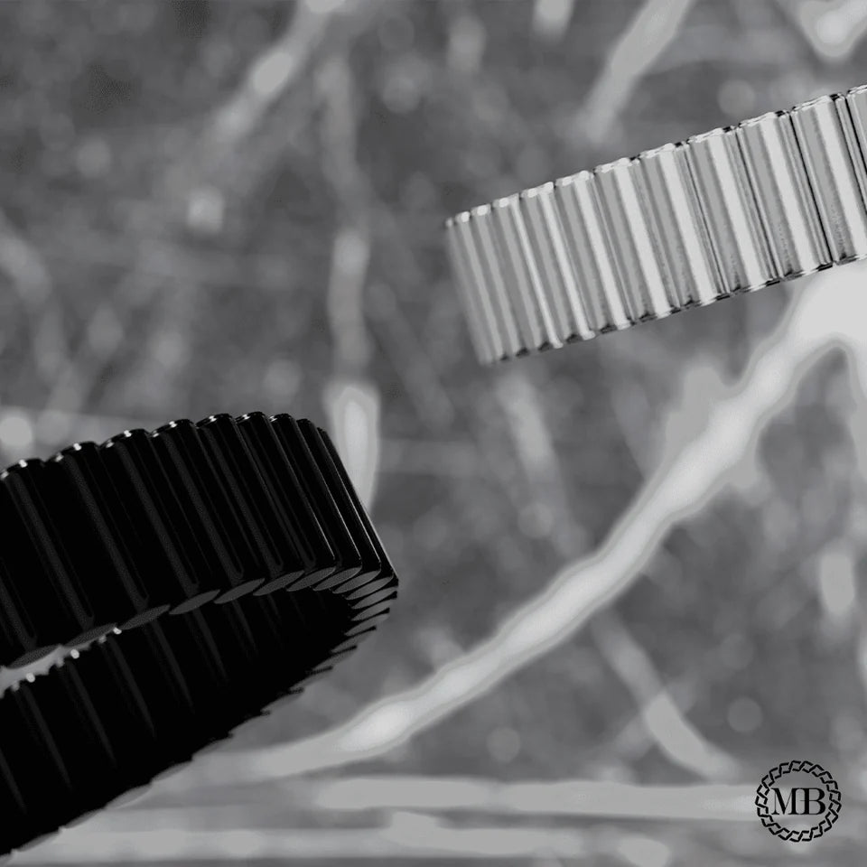 Close view of the reflective silver and deep black cylinders